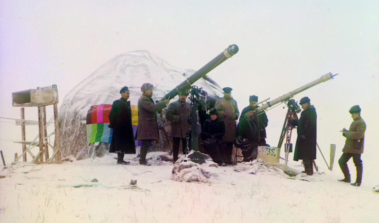 1907: People observe a solar eclipse near the Cherniaevo Station in the Tian-Shan mountains above the Saliuktin mines, Golodnaia Steppe, Kyrgyzstan. 