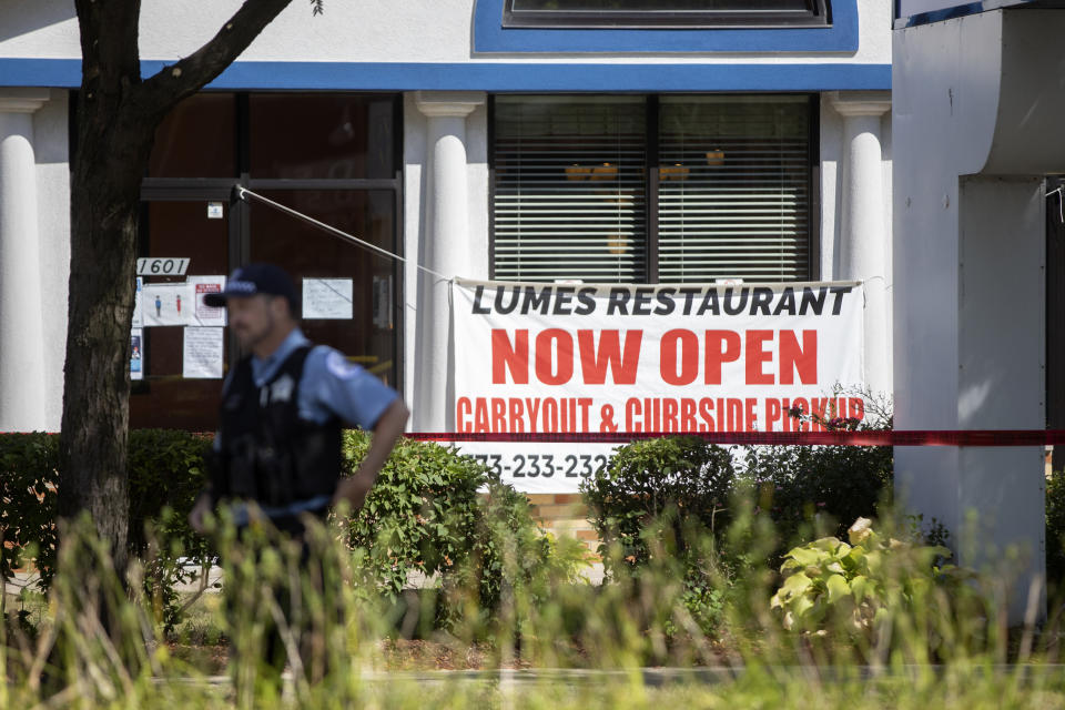 Chicago police officers work at the scene where multiple people were shot, one fatally, at Lumes Pancake House Sunday, Aug. 30, 2020, on Chicago’s far South Side. (Erin Hooley/Chicago Tribune via AP)