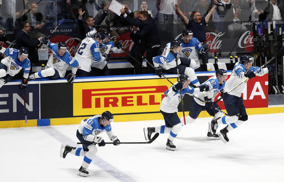 Players of Finland celebrate after winning the Ice Hockey World Championships semifinal match between Russia and Finland at the Ondrej Nepela Arena in Bratislava, Slovakia, Saturday, May 25, 2019. (AP Photo/Petr David Josek)