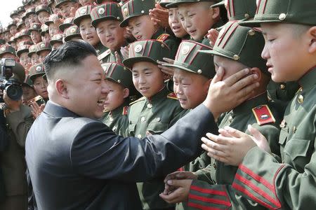 North Korean leader Kim Jong Un visits Mangyongdae Revolutionary School on the occasion of the 68th anniversary of the founding of the Korean Children's Union (KCU) in this undated photo released by North Korea's Korean Central News Agency (KCNA) in Pyongyang June 7, 2014. REUTERS/KCNA (NORTH KOREA - Tags: POLITICS IMAGES OF THE DAY)