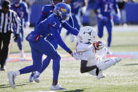 Texas wide receiver Xavier Worthy, right, is stopped by Kansas cornerback Ra'Mello Dotson (3) during the first quarter of an NCAA college football game on Saturday, Nov. 19, 2022, in Lawrence, Kan. (AP Photo/Colin E. Braley)