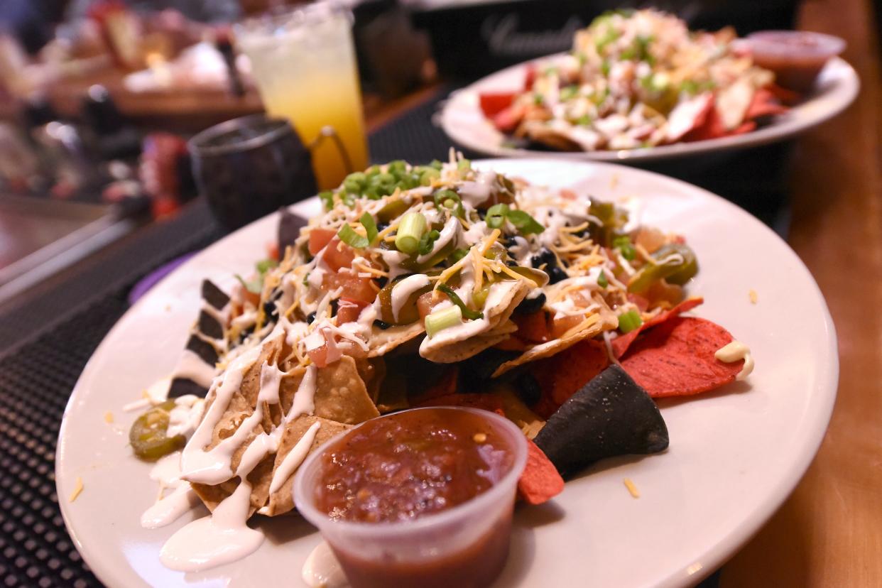 The Pulled Chicken Nachos at Front Street Brewery are always a hit. The Brewery opened in May 1995 and has been serving local microbrews and its famous Pulled Chicken Nachos ever since.