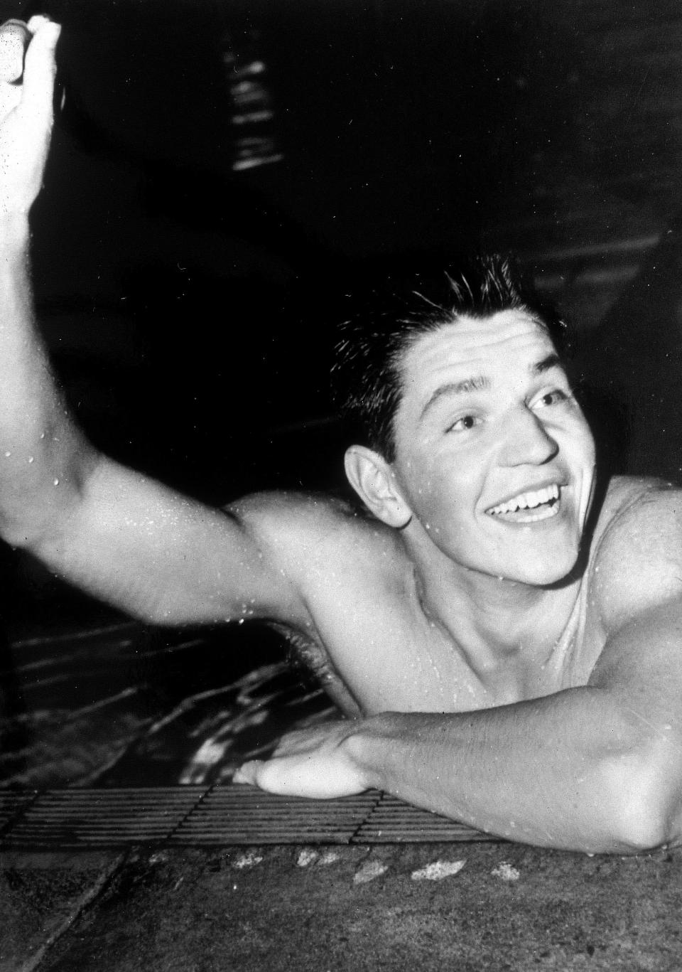 ROME, ITALY - 1960: John Konrads of Australia celebrates after winning the mens 1500m freestyle during the 1960 Rome Olympics held in Rome, Italy. Konrads was an Australian swimmer of the 1950s and 1960s, who won the 1500 m freestyle at the 1960 Summer Olympics in Rome. In his career, he set 26 individual world records. (Photo by Getty Images)
