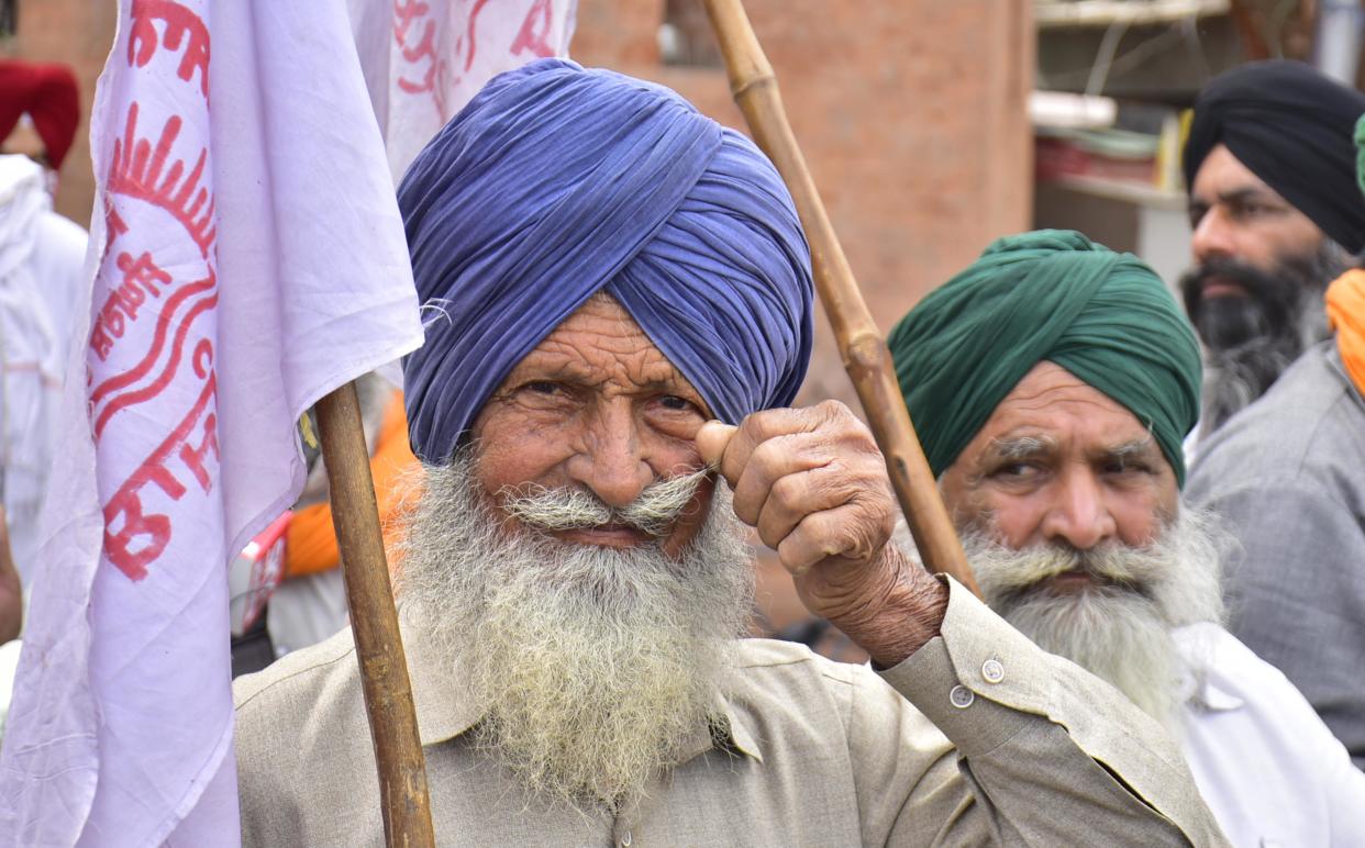 Farmers at Hall Bazaar as they appeal to keep shops closed on Bharat Bandh during their ongoing agitation against the new farm laws on March 25, 2021 in Amritsar, India. (Photo by Sameer Sehgal/Hindustan Times via Getty Images)