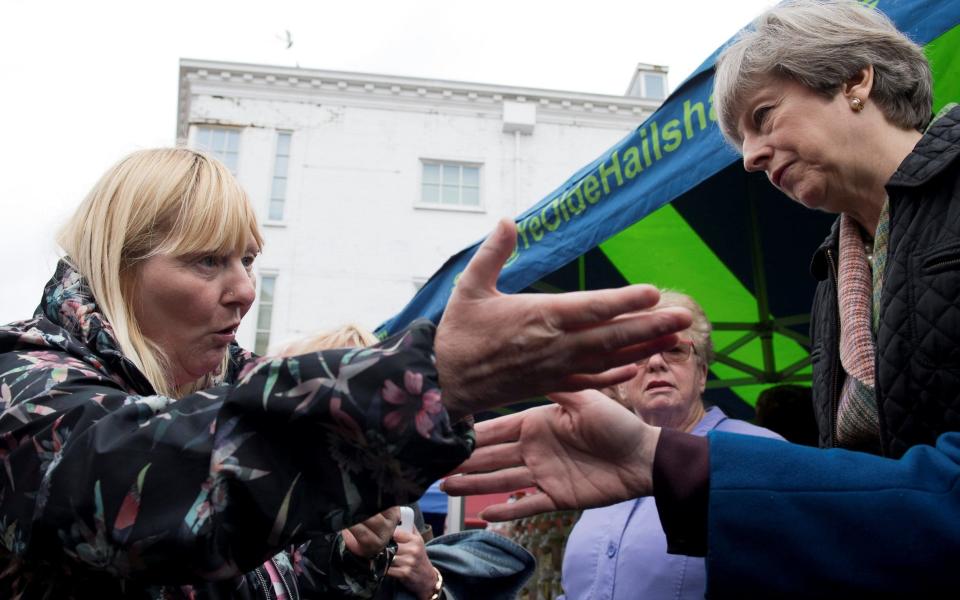 Theresa May is challenged on a visit to Abingdon - Credit: Reuters