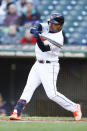 Cleveland Guardians' Jose Ramirez hits a single off Kansas City Royals starting pitcher Jonathan Heasley during the first inning of a baseball game, Wednesday, Oct. 5, 2022, in Cleveland. (AP Photo/Ron Schwane)