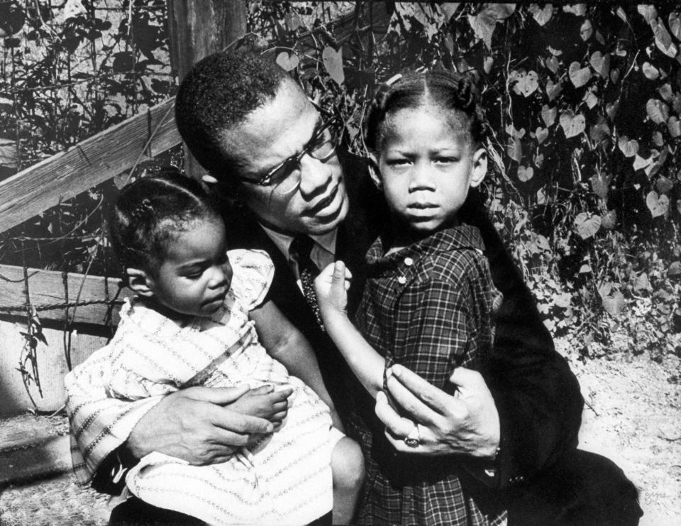 Malcolm X with his daughters Qubilah  and Attilah.