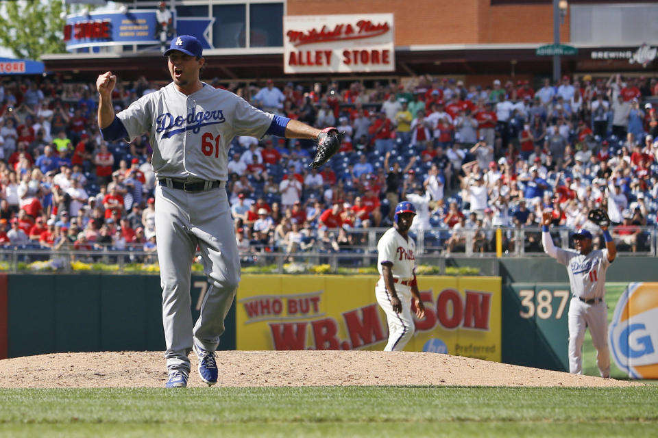Los Angeles Dodgers starting pitcher Josh Beckett reacts after striking out Philadelphia Phillies' Chase Utley looking for a no-hitter baseball game, Sunday, May 25, 2014, in Philadelphia. Los Angeles won 6-0. (AP Photo/Matt Slocum)