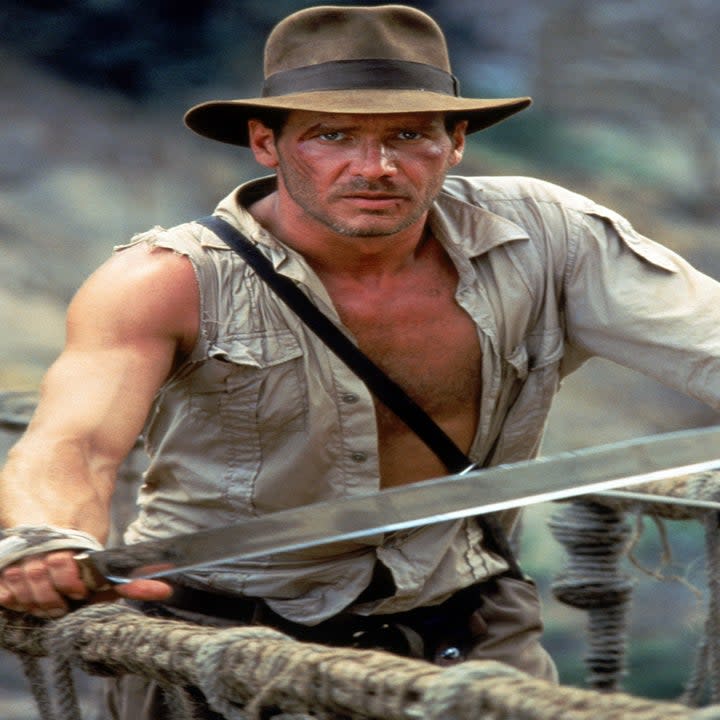 indiana jones holding a sword