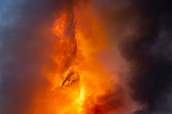 The tower of the historic Boersen stock exchange stands in flames as the building is on fire in central Copenhagen, Denmark on April 16, 2024. The building, one of the oldest in the Danish capital, was undergoing renovation work when in the morning it caught fire, whose cause was yet unknown. The building was erected in the 1620s as a commercial building by King Christian IV and is located next to the Danish parliament. (Photo by Ida Marie Odgaard / Ritzau Scanpix / AFP) / Denmark OUT (Photo by IDA MARIE ODGAARD/Ritzau Scanpix/AFP via Getty Images)