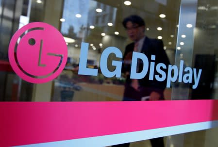 FILE PHOTO: A man walks out of the headquarters of LG Display in Seoul