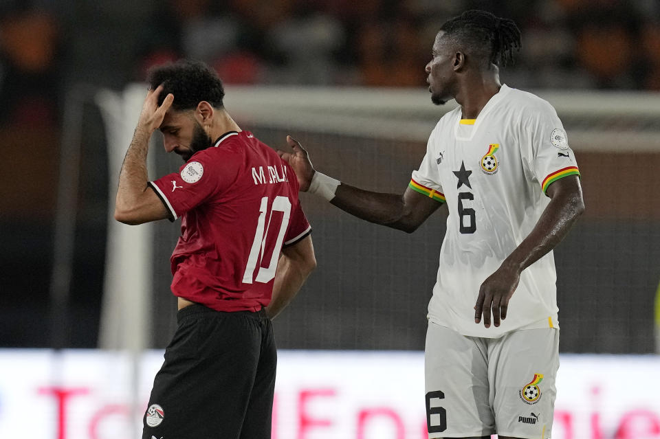 Egypt's Mohamed Salah, left, leaves the field after sustaining an injury during the African Cup of Nations Group B soccer match between Egypt and Ghana in Abidjan, Ivory Coast, Thursday, Jan.18, 2024. (AP Photo/Themba Hadebe)