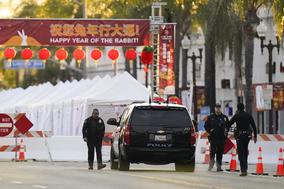 FILE - Police officers stand outside a ballroom dance club in Monterey Park, Calif., Sunday, Jan. 22, 2023. A mass shooting took place at a dance club following a Lunar New Year celebration, setting off a manhunt for the suspect. The U.S. is setting a record pace for mass killings in 2023, replaying the horror in a deadly loop roughly once a week so far this year. The bloodshed overall represents just a fraction of the deadly violence that occurs in the U.S. annually. (AP Photo/Jae C. Hong, File)