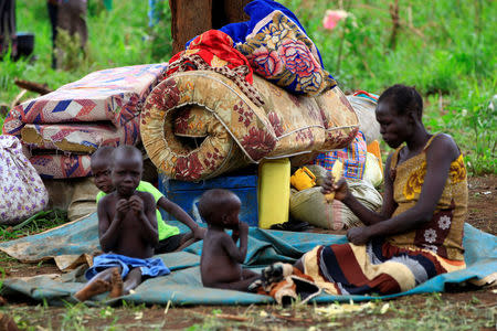An elderly woman displaced by fighting in South Sudan rests by her belongings in Lamwo after fleeing fighting in Pajok town across the border in northern Uganda, April 5, 2017. REUTERS/James Akena