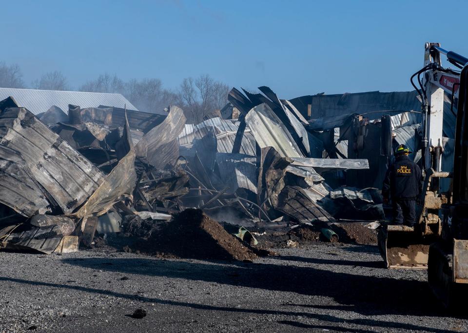 Smoldering ruins of one building at Liners Inc., also known as Patrick Excavating & Trucking, on Route 5 in Charleston Township.