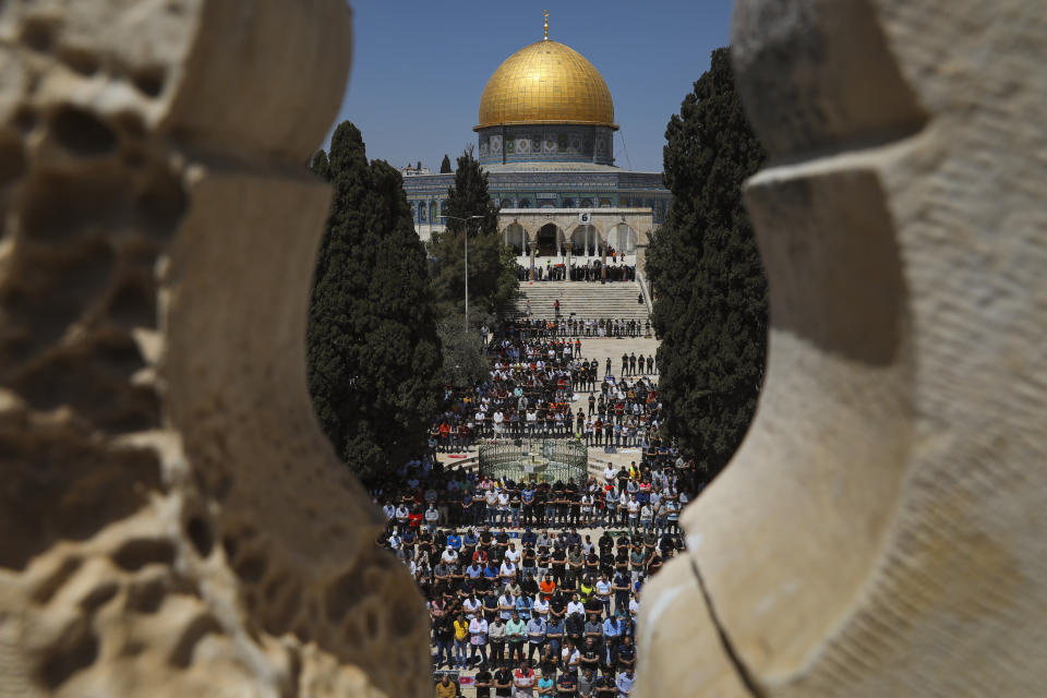 Palestinian worshipers pray during the first Friday of the holy month of Ramadan at the Al Aqsa Mosque compound in Jerusalem's old city, Friday, April. 16, 2021. (AP Photo/Mahmoud Illean)