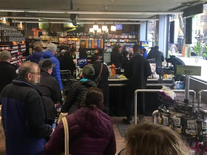 A crowded grocery store in New York City.