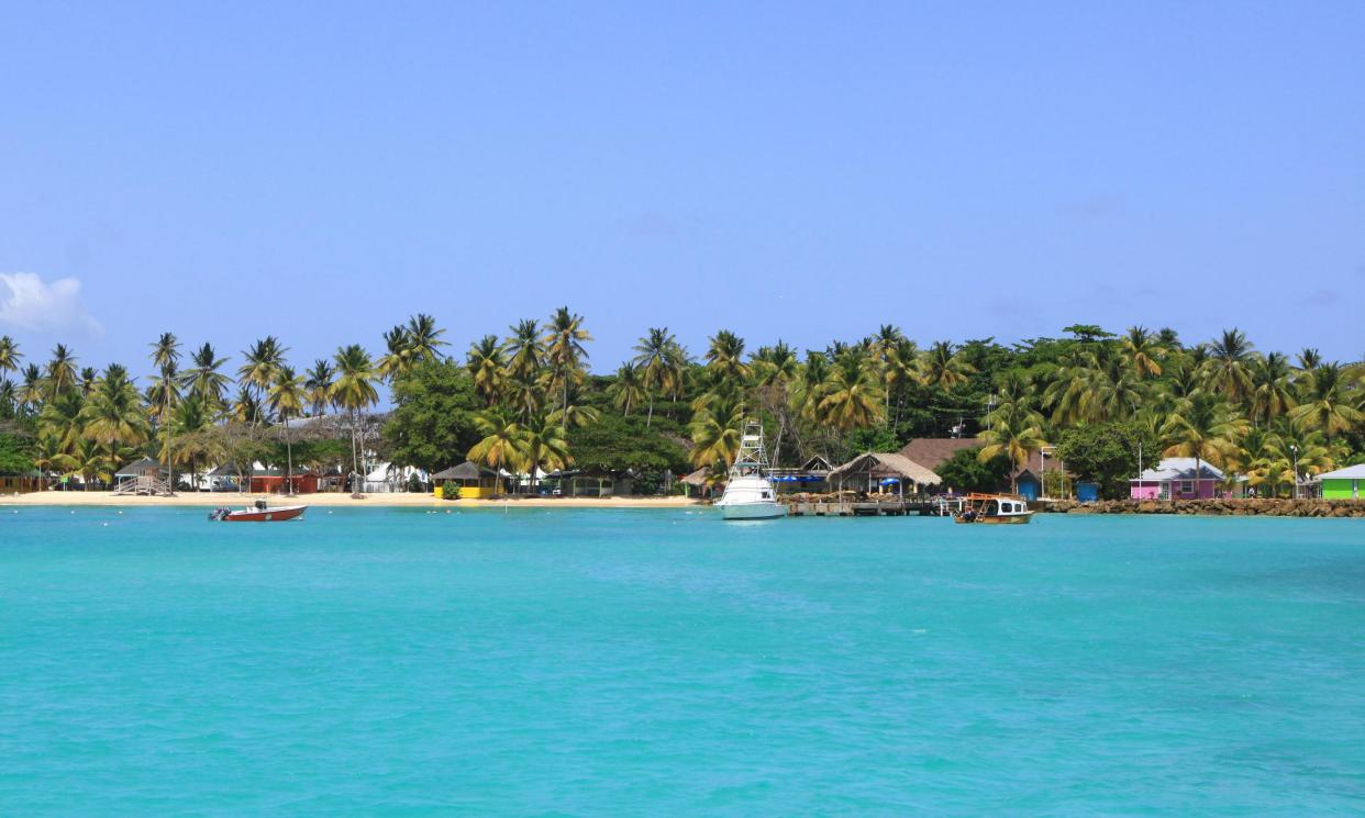 <span>A beach in Tobago. Most shark attacks in the region occur further north.</span><span>Photograph: Sean Drakes/Alamy</span>