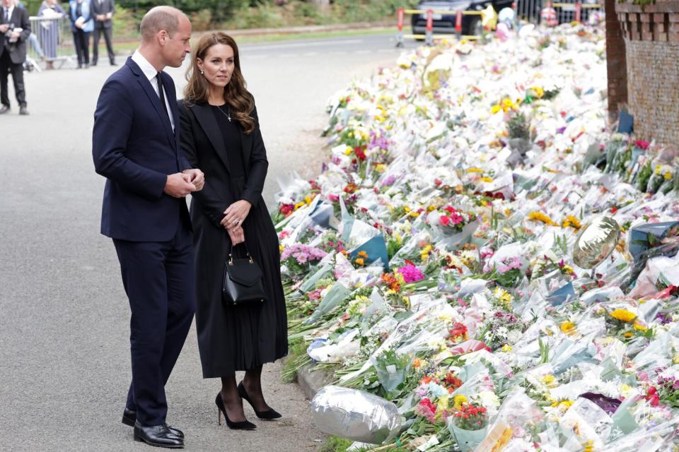 Prince William, Prince of Wales and Catherine, Princess of Wales view floral tributes at Sandringham