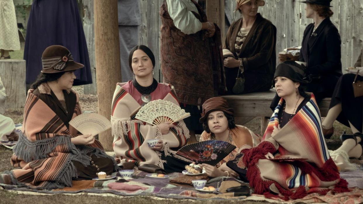 a group of people sitting on the ground