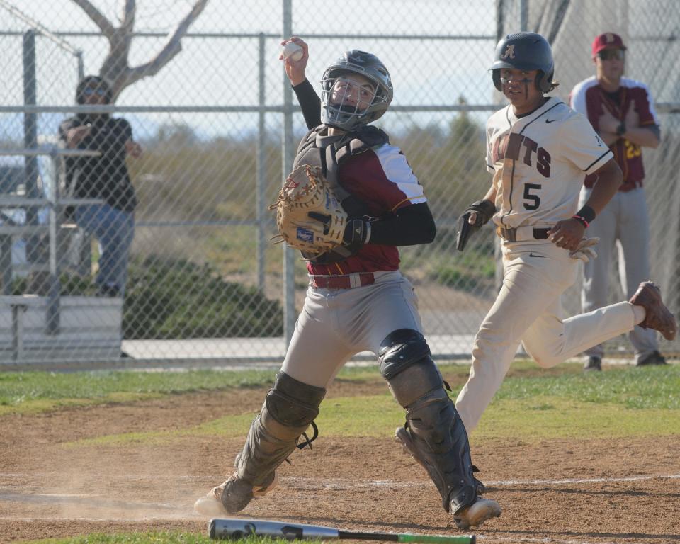 Barstow catcher Evan Hernandez throws to first to complete the double play and end the sixth inning against Adelanto on Wednesday, April 5, 2023.