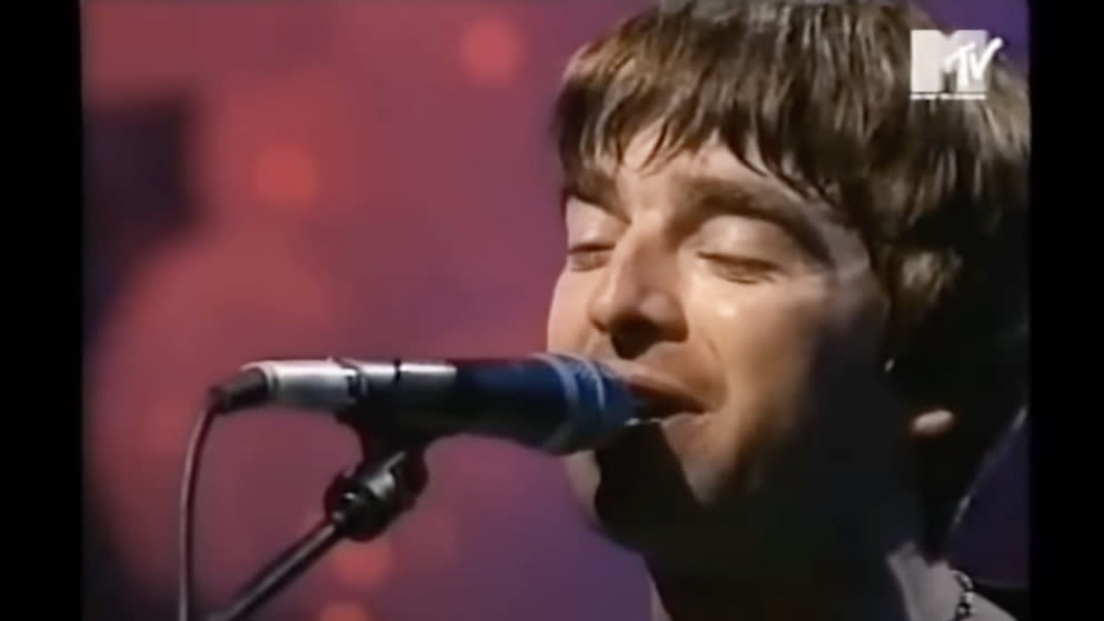  Noel Gallagher performing with Oasis for MTV Unplugged in 1996 . 