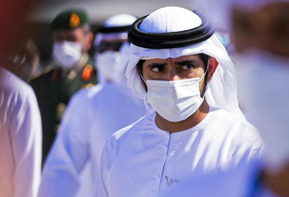 Sheikh Hamdan bin Mohammed Al Maktoum, the crown prince of Dubai, attends the Dubai Air Show in Dubai, United Arab Emirates, Sunday, Nov. 14, 2021. The biennial Dubai Air Show opened Sunday as commercial aviation tries to shake off the coronavirus pandemic. (AP Photo/Jon Gambrell)