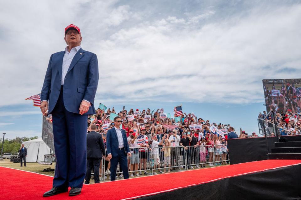 Donald Trump greets voters upon arriving at his rally in Las Vegas on 9 June 2024 (Getty Images)