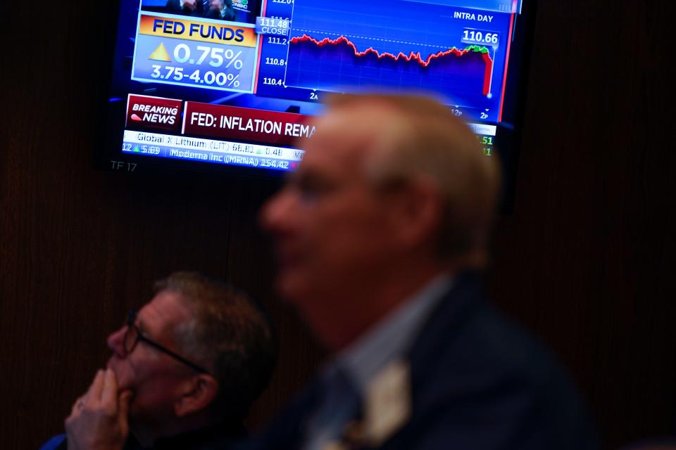 Traders work on the floor at the New York Stock Exchange as the Federal Reserve makes an announcement regarding interest rates in New York, Wednesday, Nov. 2, 2022.