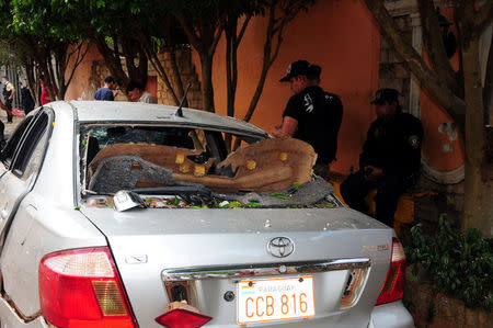 A broken car near the headquarters of private security company Prosegur is pictured in Ciudad del Este, eastern Paraguay, April 24, 2017, after a group of dozens of people carried out an assault with explosives at the site. REUTERS/Francisco Espinola