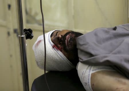 An Afghan man receives treatment at a hospital after a suicide truck bomb attack in Kabul, Afghanistan August 7, 2015. REUTERS/Omar Sobhani