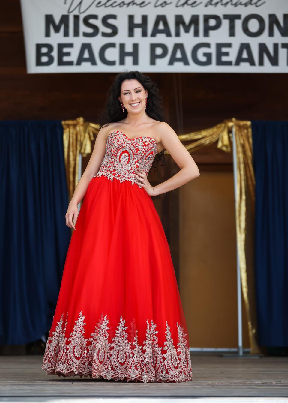 Faith Brodi, 24, of Windham, walks on stage wearing a red dress in the evening gown competition at the 77th Miss Hampton Beach Pageant.