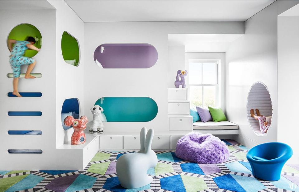 Colorful Benjamin Moore paints brighten custom built-ins in the kids’ room. Pierre Paulin chair; Kinder Modern carpet; Jasmin Anoschkin ceramics.