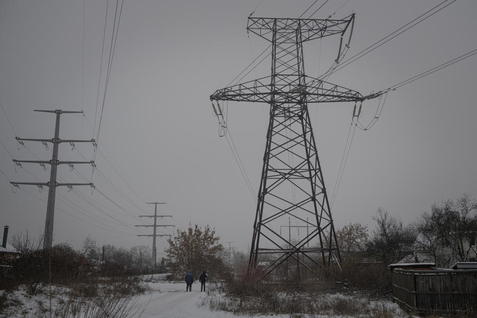 The power lines in Kyiv, Ukraine, Thursday, Dec. 8, 2022. Ukrainian utility crews struggling to patch up power lines during a two-month Russian military blitz targeting Ukrainian infrastructure are learning to adapt. And just as on the battlefield, Ukrainians are learning to respond quickly on the new energy front drawn inside homes, hospitals, offices, and schools in yet another act of defiance against a powerful invader. (AP Photo/Andrew Kravchenko)