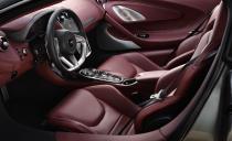 <p>The interior can be wrapped in soft nappa leather. But wood veneers and chrome vents remain the domain of Bentley, not McLaren.</p>