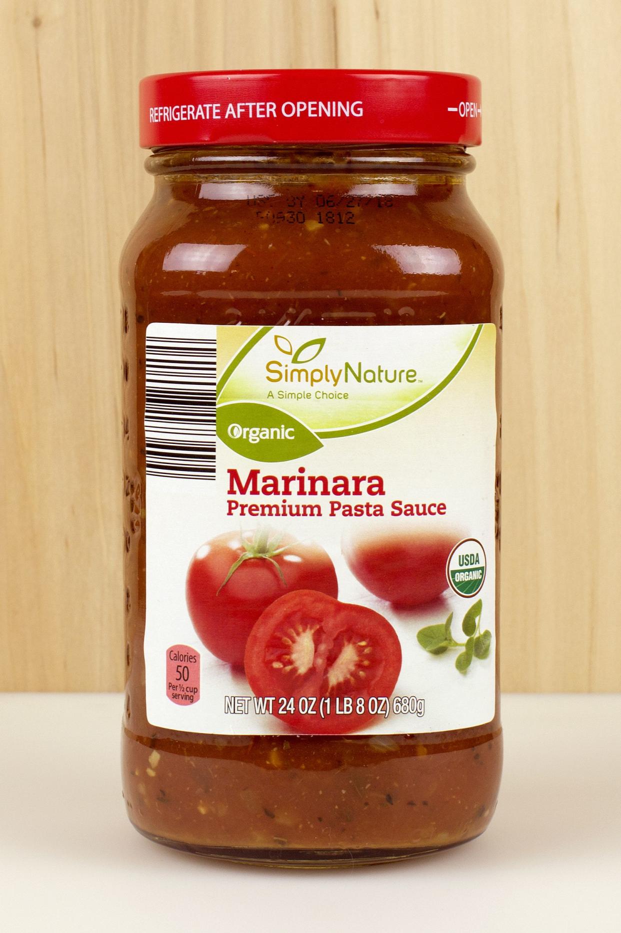 jar of Simply Nature brand marinara pasta sauce with a wood background