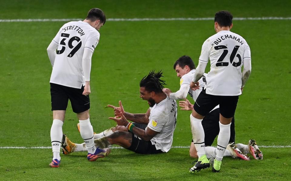 Colin Kazim-Richards of Derby County celebrates with teammates Jack Stretton and Lee Buchanan after scoring his team's first goal during the Sky Bet Championship match between Derby County and Coventry City at Pride Park Stadium on December 01, 2020 in Derby, England. Sporting stadiums around the UK remain under strict restrictions due to the Coronavirus Pandemic as Government social distancing laws prohibit fans inside venues resulting in games being played behind closed doors. - Getty Images Europe /Laurence Griffiths 