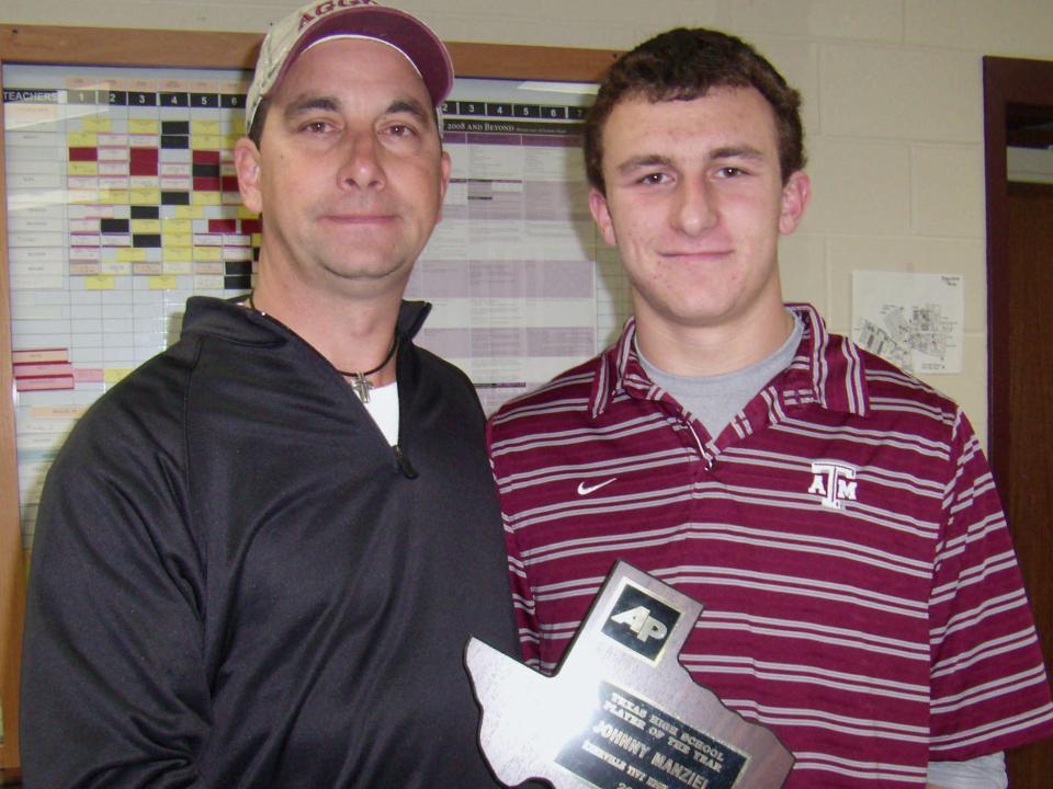 Johnny Manziel (right) and his dad, Paul, pose with the former's "Texas High School Player of the Year" award.