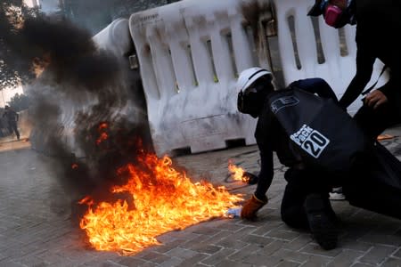 Anti-government protester prepares to throw a Molotov cocktail during a demonstration near Central Government Complex in Hong Kong