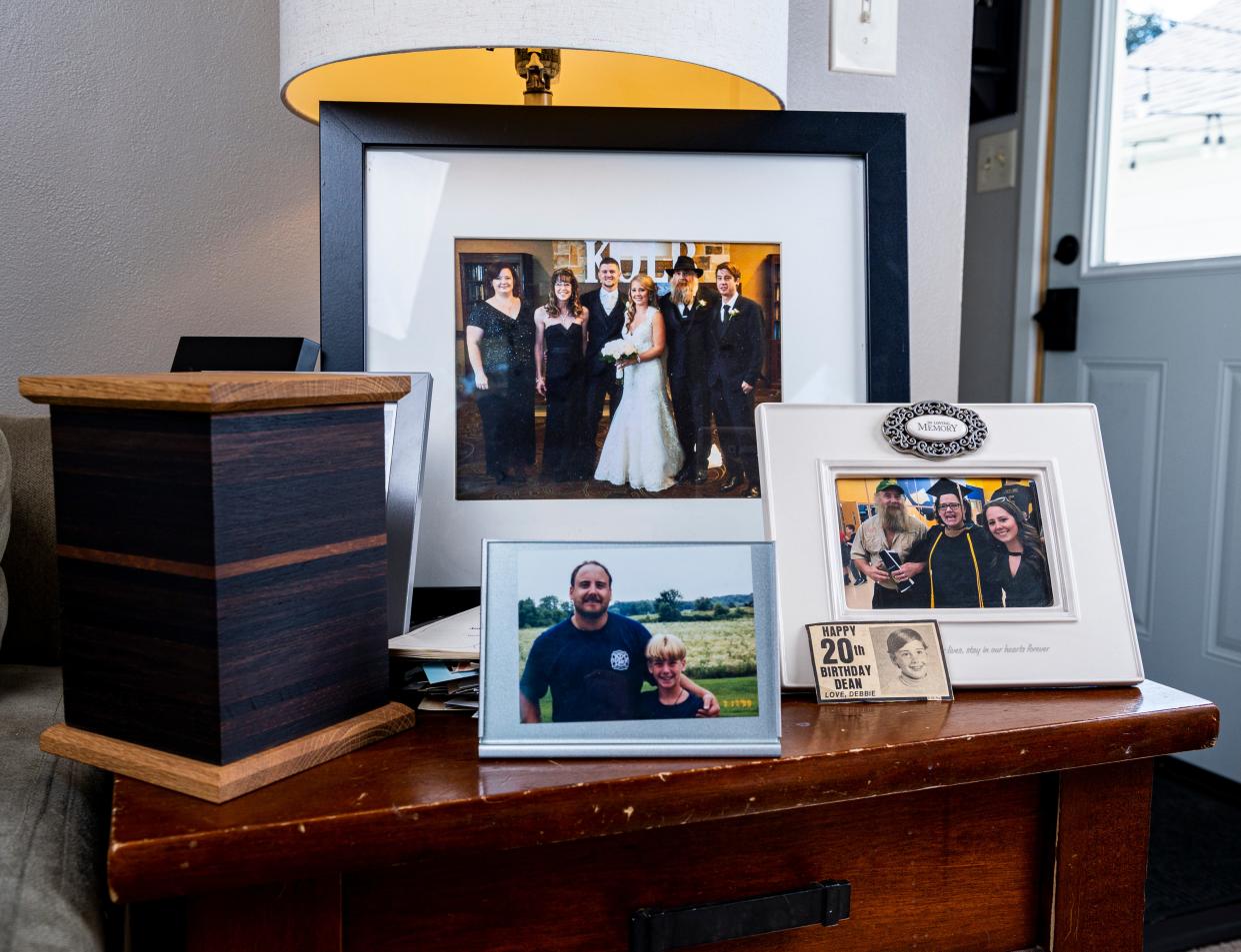 Photos of Dean Hoffmann along with an urn are displayed in his daughter Megan Kolb's home on Sept. 9, 2023 in Cedarburg.