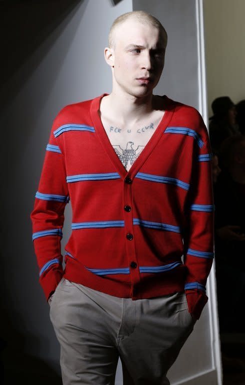 A model presents Julien David's fall-winter 2013-2014 menswear collection on January 16, 2013 at Men's Fashion Week in Paris. The Tokyo-based French designer made his men's catwalk debut with a casual but elegant streetwear-inspired collection