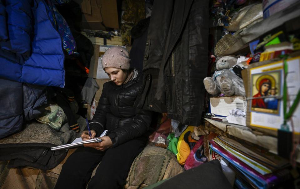 Evelin, 11, lives in a 4-metre-square storeroom underground with her mother and grandmother to avoid the fighting in Lyman, Donetsk. - Anadolu Agency