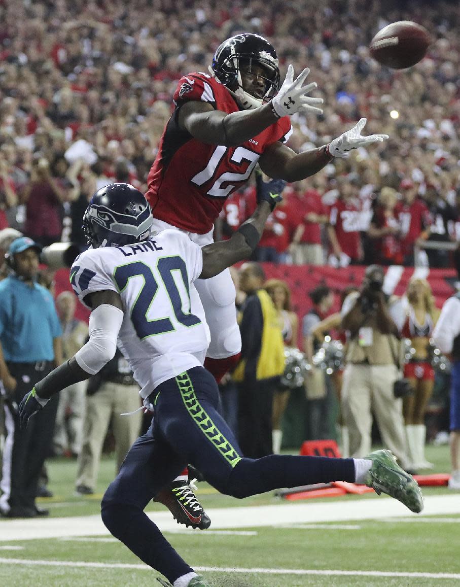 Atlanta Falcons wide receiver Mohamed Sanu catches a touchdown pass over Seattle Seahawks Jeremy Lane (20) during the fourth quarter of an NFL football NFC divisional playoff game Saturday, Jan. 14, 2017, in Atlanta. (Curtis Compton/Atlanta Journal-Constitution via AP)