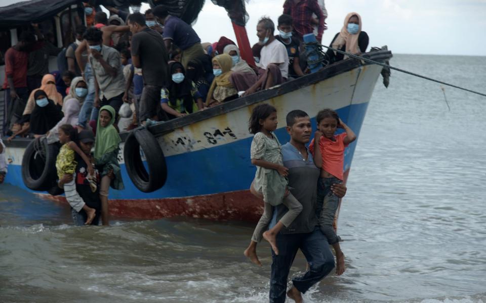 Residents conduct forced evacuation of Rohingya ethnic refugees from ships on the coast of Lancok, Syantalira Bayu District, North Aceh District - Barcroft Media