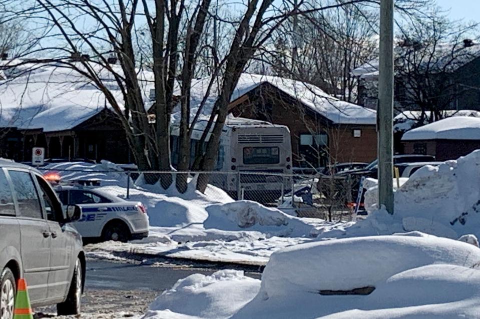 Laval, Canada, Police secure the scene where a city bus (C) crashed into a day care center on February 8, 2023 (AFP via Getty Images)