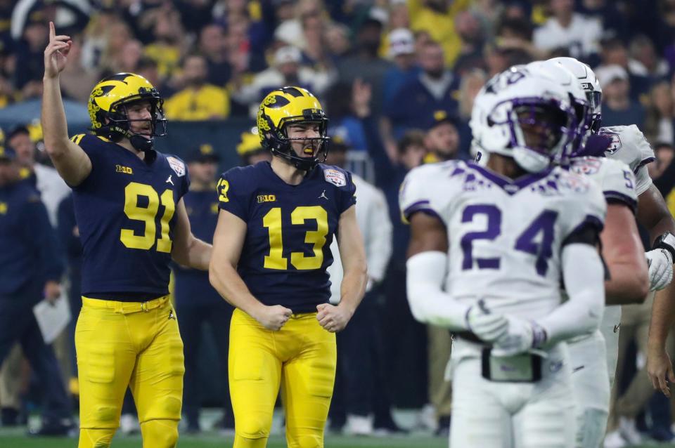 Michigan's Brad Robbins (91) and kicker Jake Moody celebrate a field goal during the Fiesta Bowl last season. Moody was drafted by the San Francisco 49ers in the third round (99th overall).