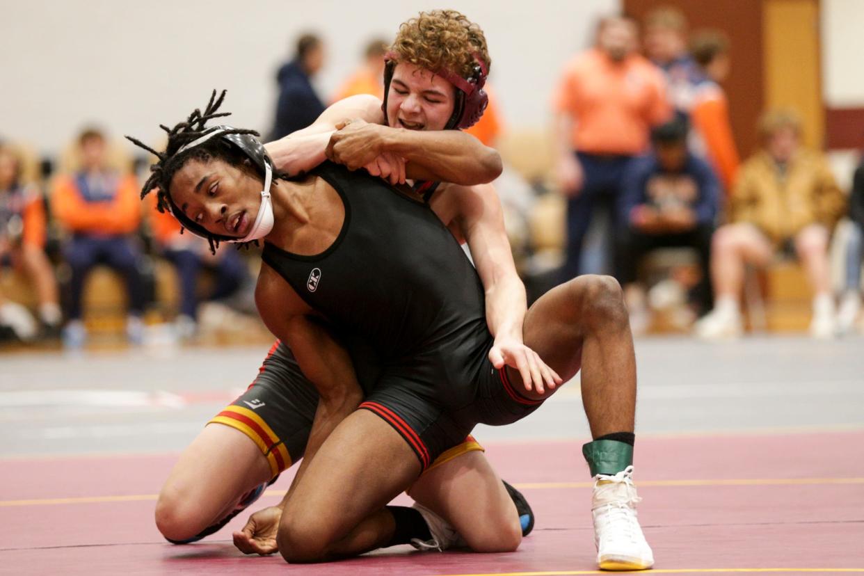 Portage’s E`Shawn Tolbert wrestles McCutcheon’s Aiden Dallinger during a 106 pound championship bout in the Kyle Osborn Memorial Invitational, Saturday, Dec. 18, 2021 in Lafayette.