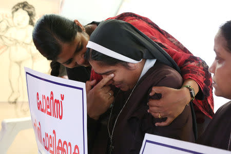 A woman consoles a nun during a protest demanding justice after an alleged sexual assault of a nun by a bishop in Kochi, in the southern state of Kerala, India, September 13, 2018. REUTERS/Sivaram V