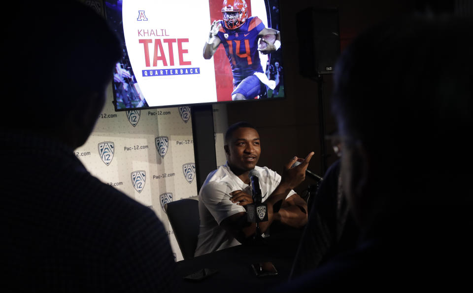 Arizona quarterback Khalil Tate answers questions during the Pac-12 Conference NCAA college football Media Day Wednesday, July 24, 2019, in Los Angeles. (AP Photo/Marcio Jose Sanchez)