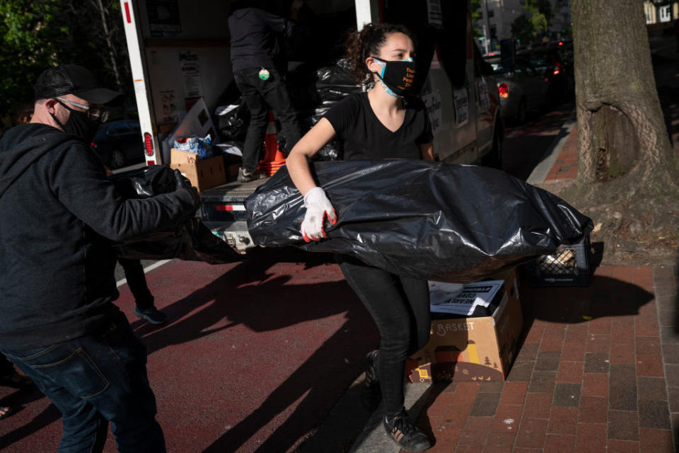 The fake bodies were loaded from trucks to make a powerful statement. Source: Getty